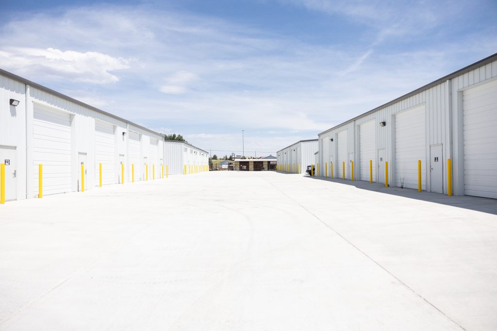 View down the center of facility with storage buildings on either side
